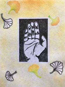 a watercolor piece of a hand reaching outward framed against leaves